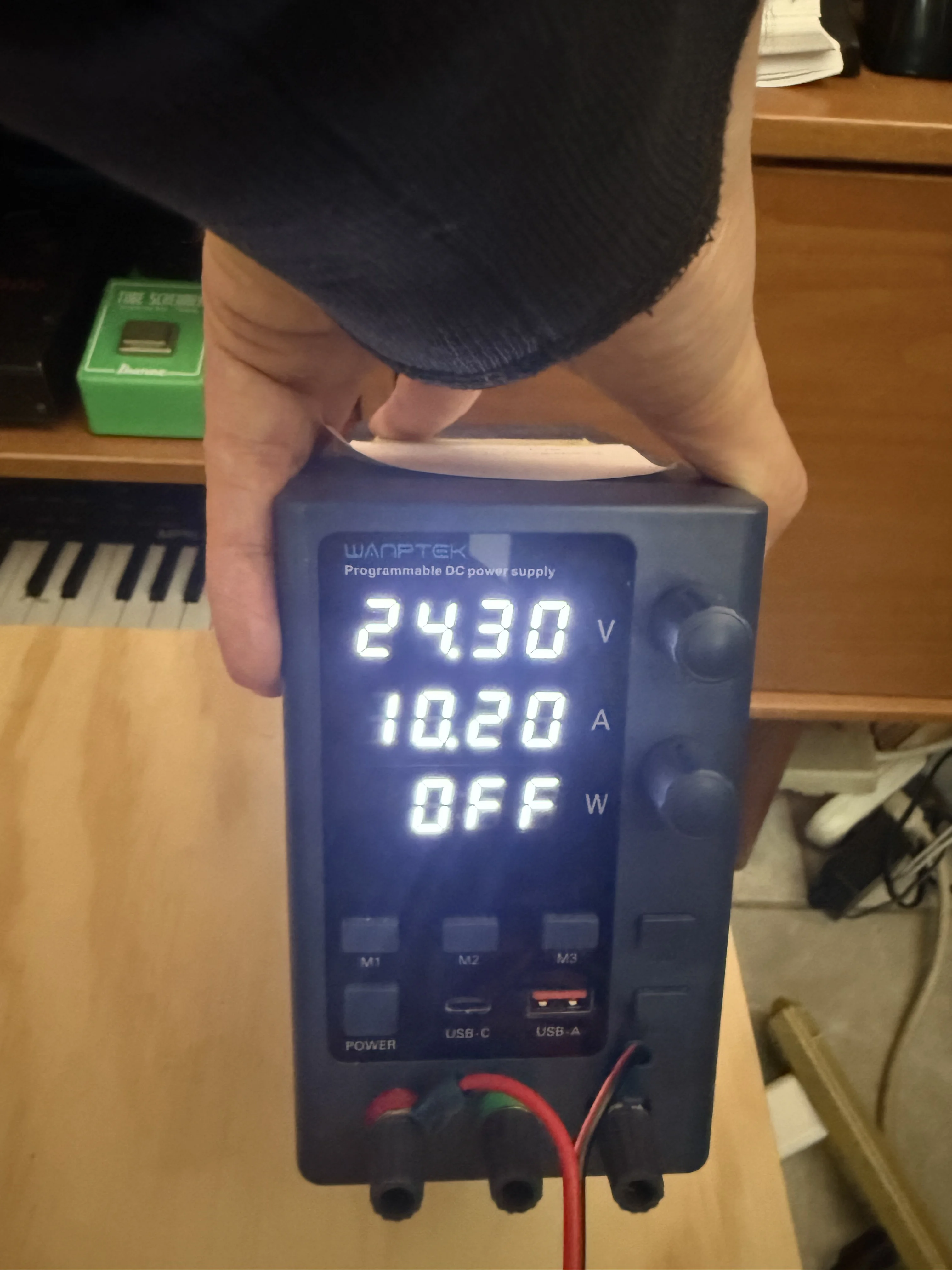 WANPTEK programmable supply set near 24.3 V