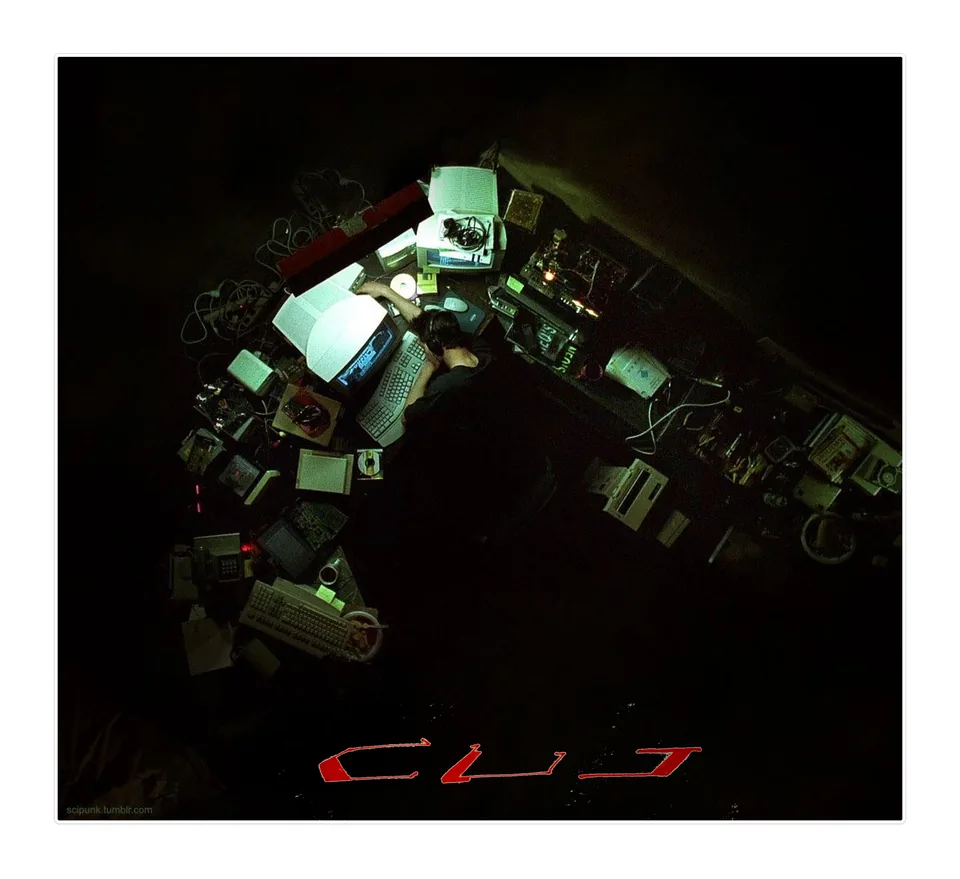 Dark photograph of an object arrangement lit in green with a red CUT wordmark beneath
