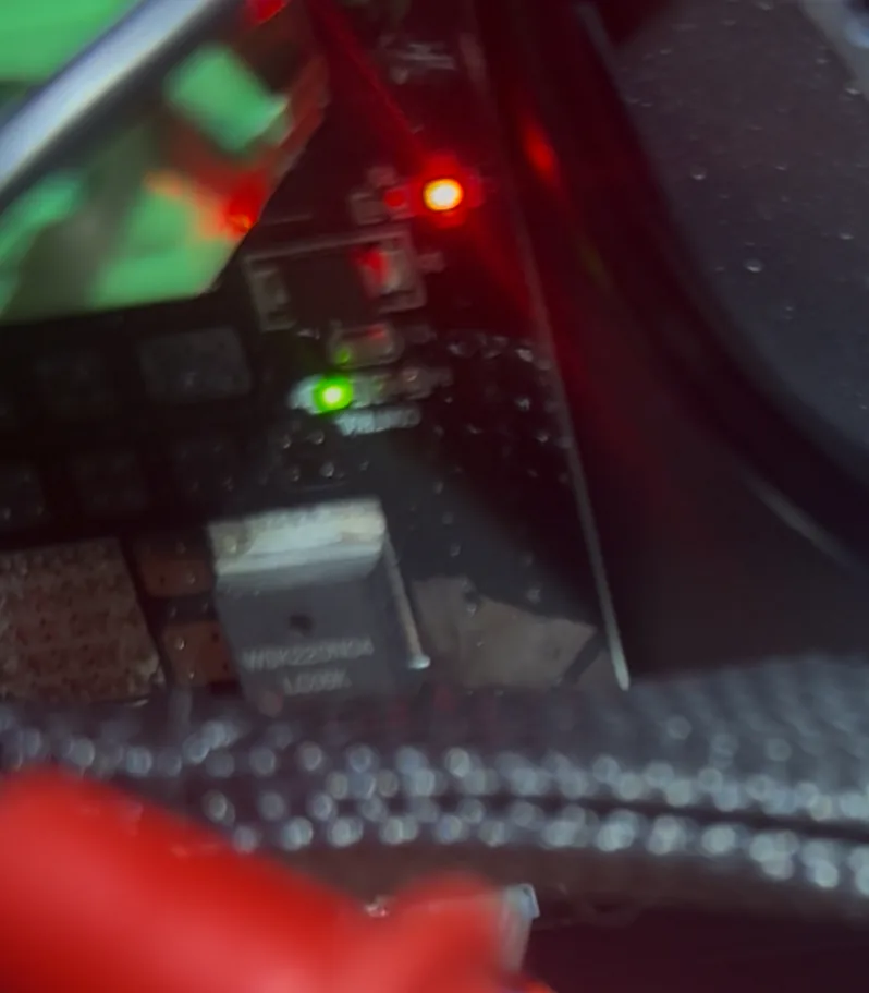 Adapter board with red and green LEDs lit during FET forced-on test