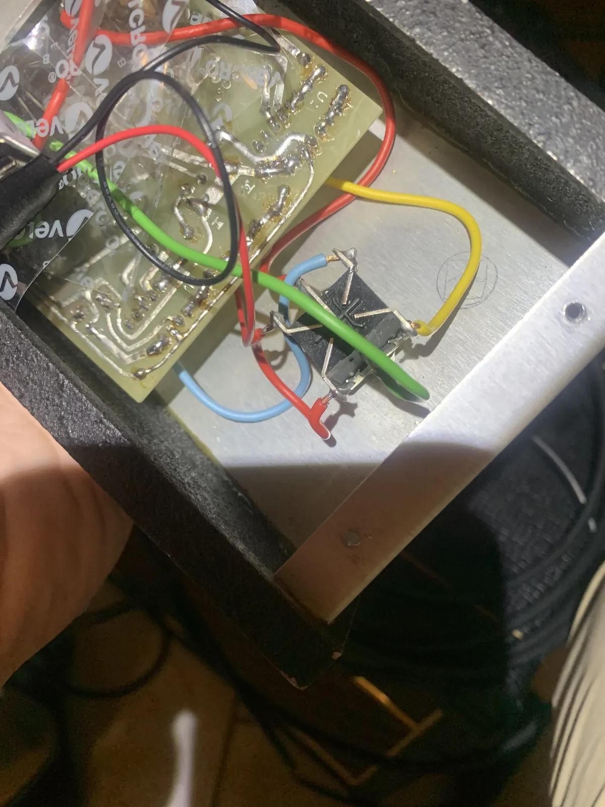 Inside the Controfuzz enclosure showing the circuit board and colored wiring