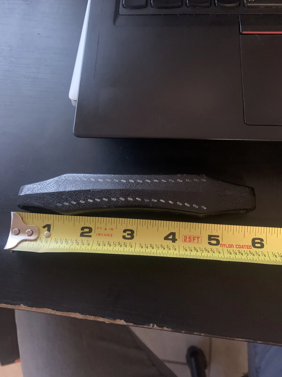 Measuring a replacement handle with a tape measure
